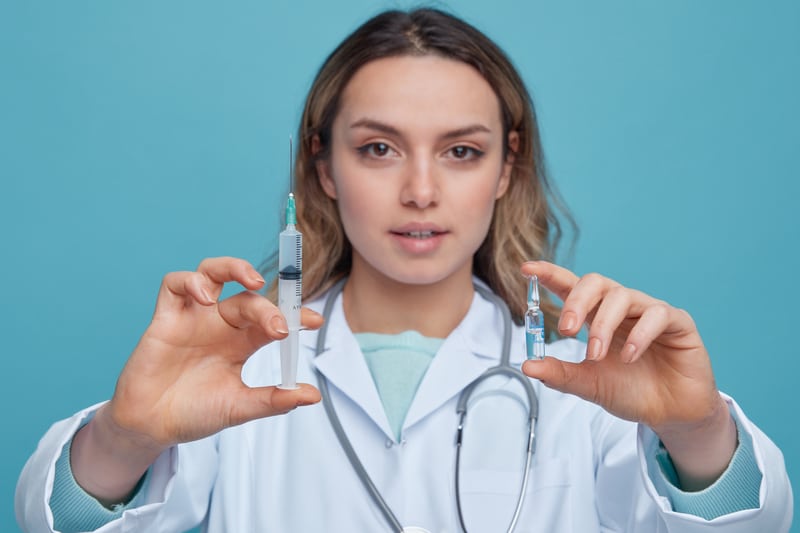 How Much Does Botox Cost? Price Per Unit, Per Area &Amp; What To Expect 7 Close-Up View Confident Young Female Doctor Wearing Medical Robe Stethoscope Around Neck Stretching Out Syringe And Botox