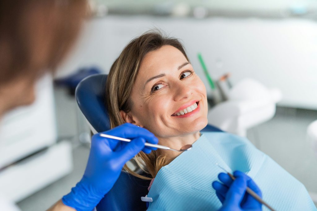An image of a women getting here teeth done