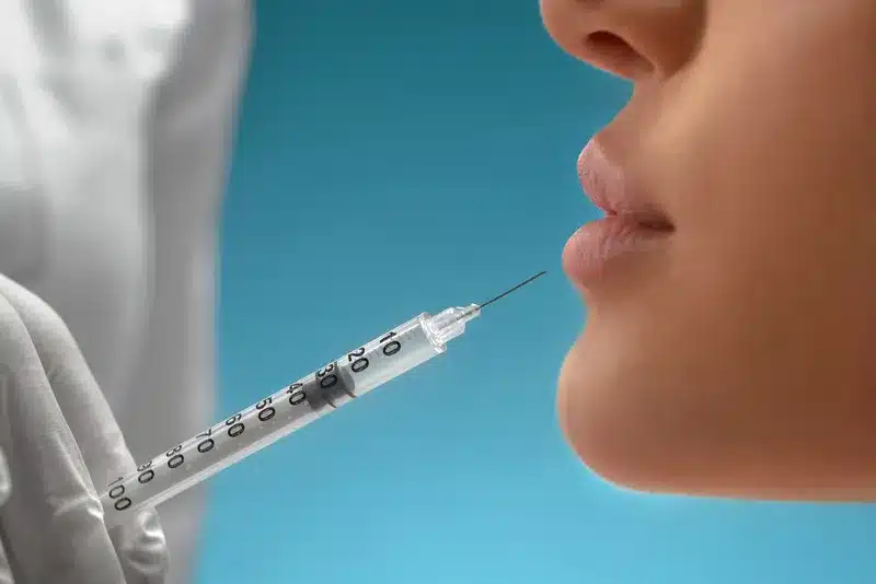 Cosmetic Botox Injections Into Lips Of A Woman