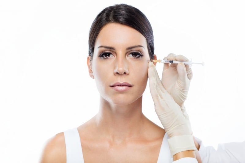 Cosmetic Botox Injection Near The Eye Area Showing Facial Aesthetic Treatment Performed In A Clinical Setting