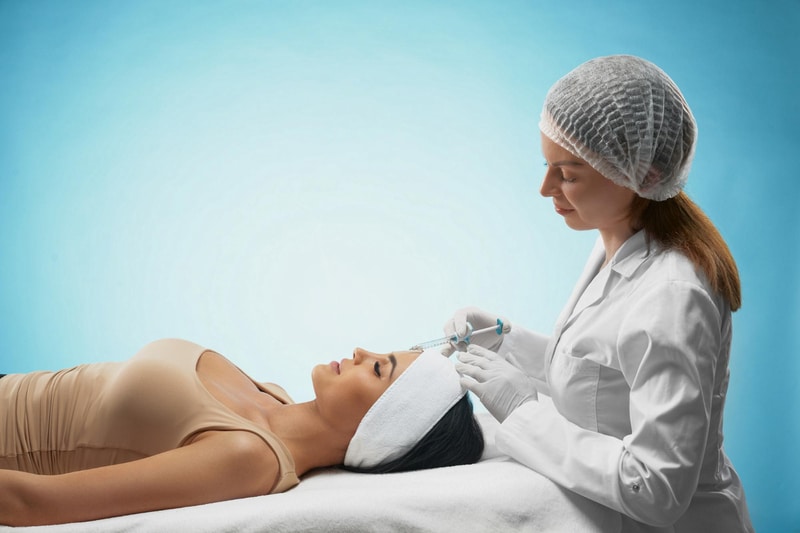 How To Add Medical Aesthetic Services To Your Business 4 Medical Aesthetic Provider Performing Botox Injection On Patient In Clinical Treatment Room