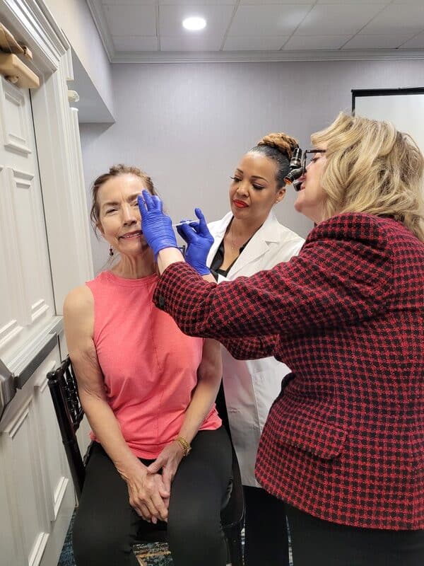 Provider Practicing A Facial Injection On A Live Model With Instructor Supervision During An Aafe Tmj Course.